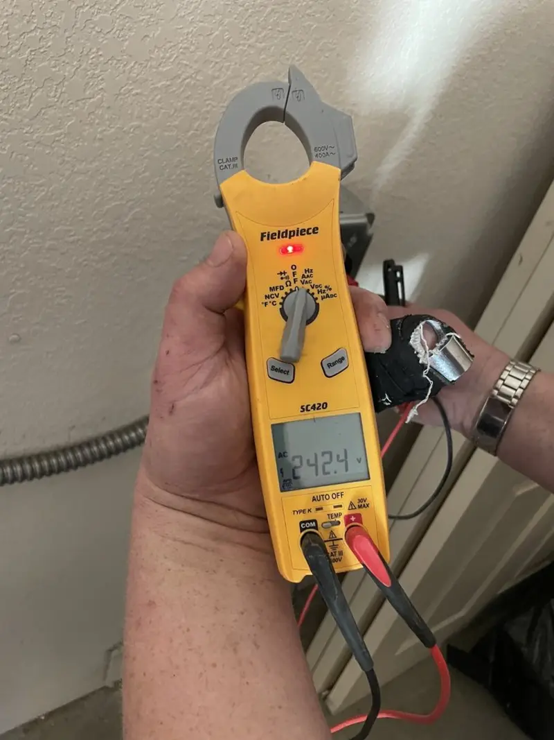 Voltage testing with clamp meter during Electrical Installation Services in Georgetown